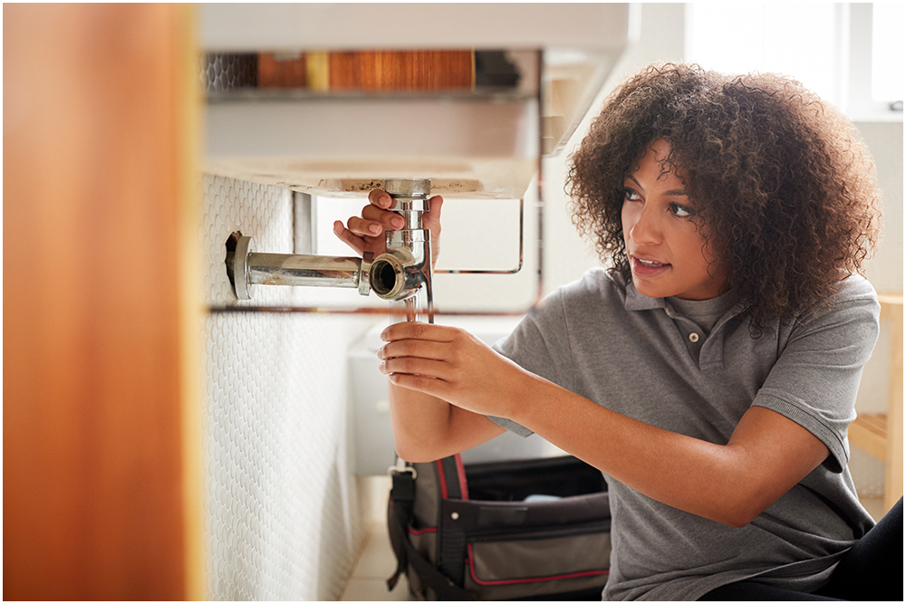 Plumber fixing sink